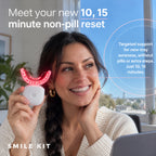 Woman holding orthodontic red light device