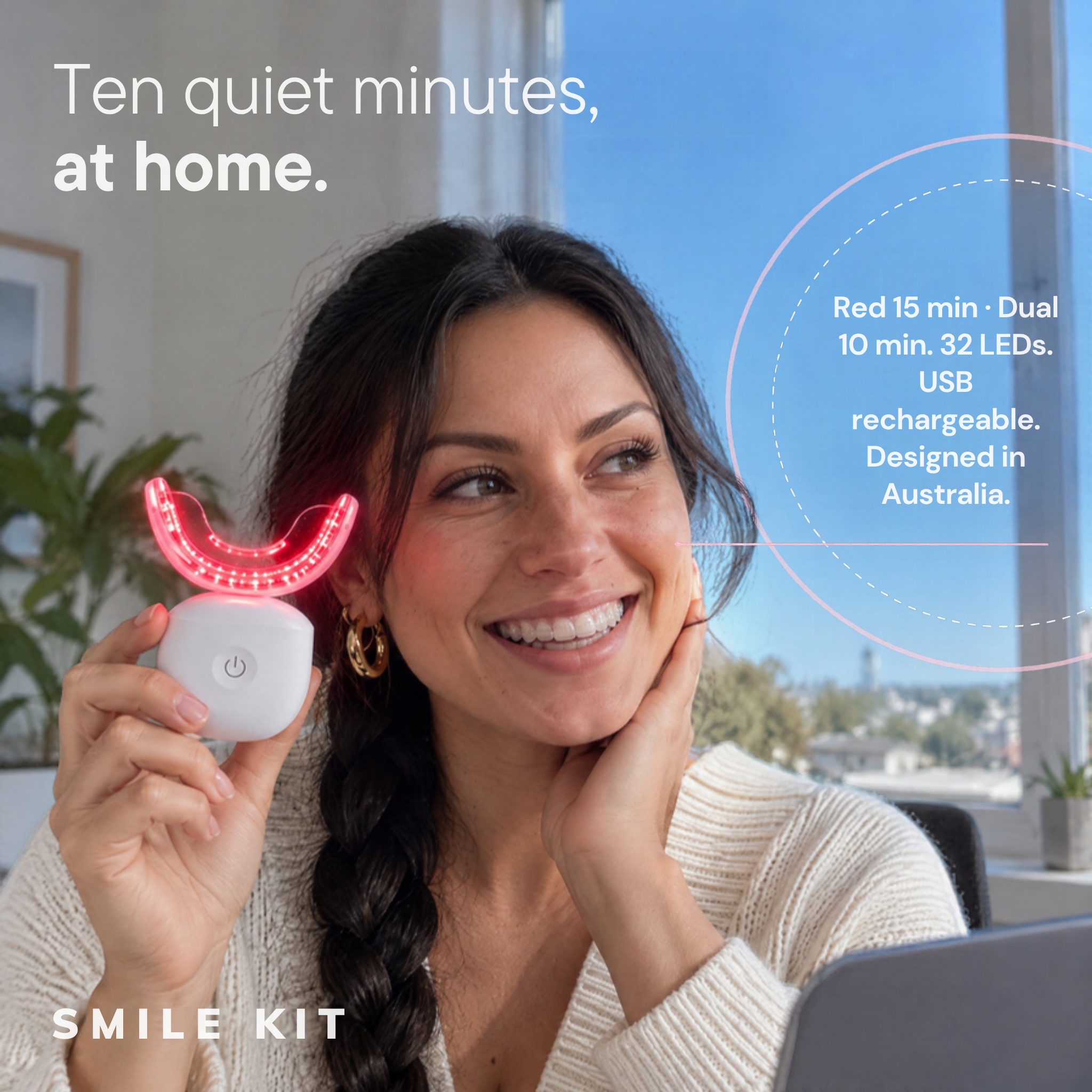 Woman holding the Smile Kit Oral Red Light with its red LEDs on